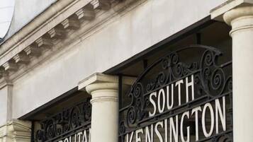 A sign for the Underground station and the South Kensington Station entrance.