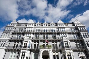A multi-story building with a symmetrical facade, large windows, and a central entrance. - The Ampersand Hotel - Small Luxury Hotels of the World (London)