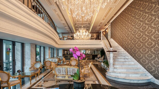 A grand lobby with a marble staircase, elegant furniture, and a large chandelier. - Rixos Pera Istanbul - Nickelodeon Play Access (Istanbul)