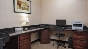 A hotel office with a desk, chair, printer, and a framed picture on the wall. - Holiday Inn Express & Suites Lafayette East by IHG (Lafayette)