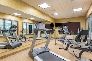 A gym with treadmills, exercise bikes, and weights. - Holiday Inn Express & Suites Lafayette East by IHG (Lafayette)
