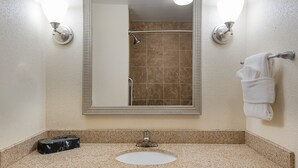A bathroom with a rectangular mirror, a sink, and a towel rack. - Holiday Inn Express & Suites Lafayette East by IHG (Lafayette)