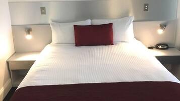 Premium bedding, desk, laptop workspace, blackout curtains