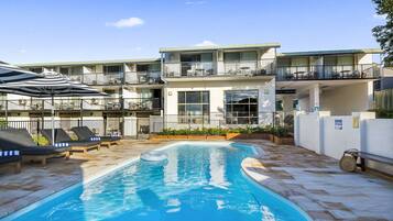 Outdoor pool, open 8:00 AM to 7:00 PM, pool umbrellas, pool loungers