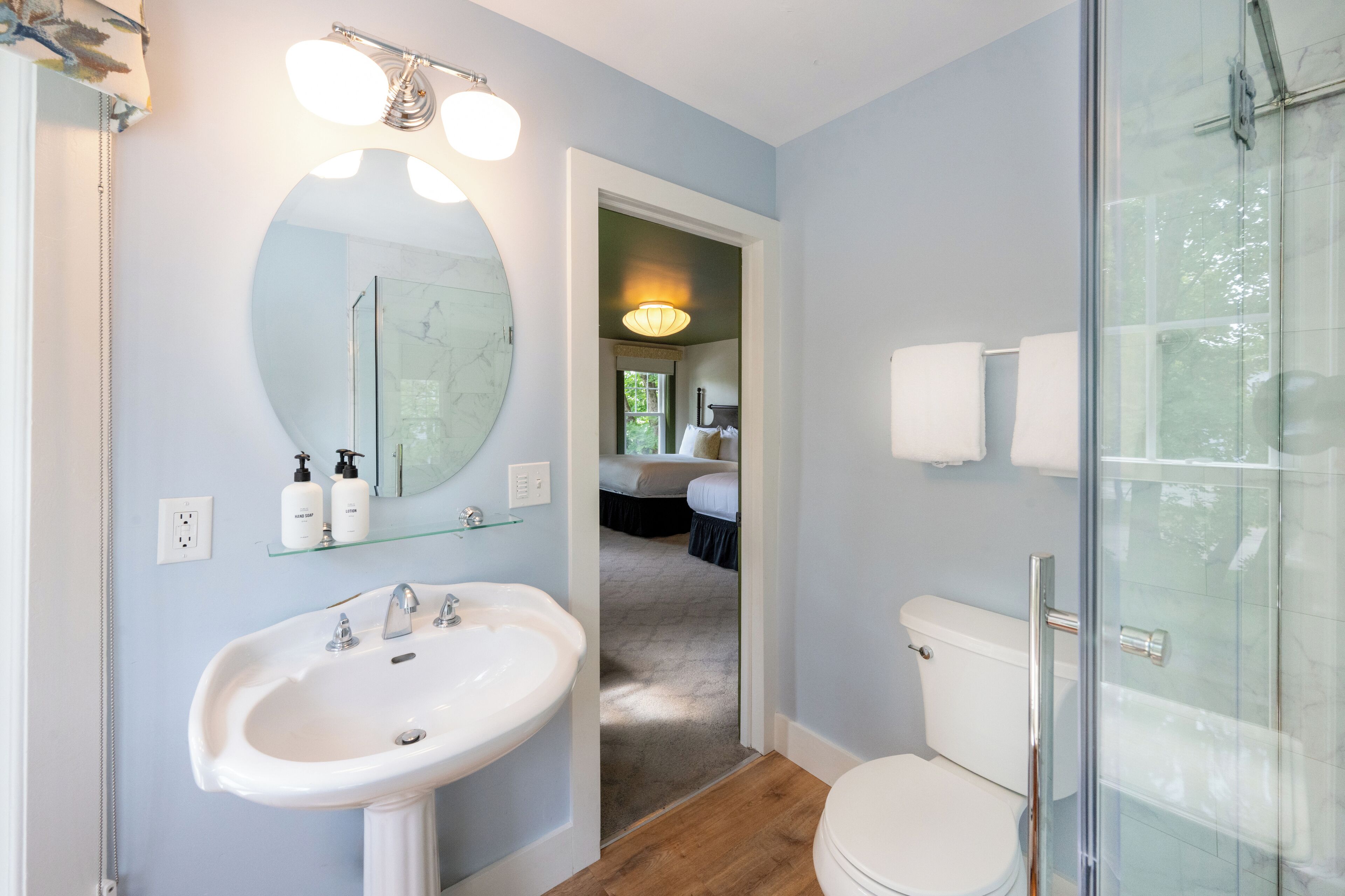 shower, designer toiletries, hair dryer, towels