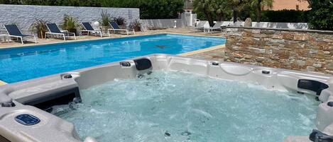 Outdoor pool, a heated pool, pool loungers