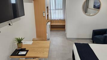 Habitación Deluxe | Cortinas blackout, insonorización y tabla de planchar con plancha