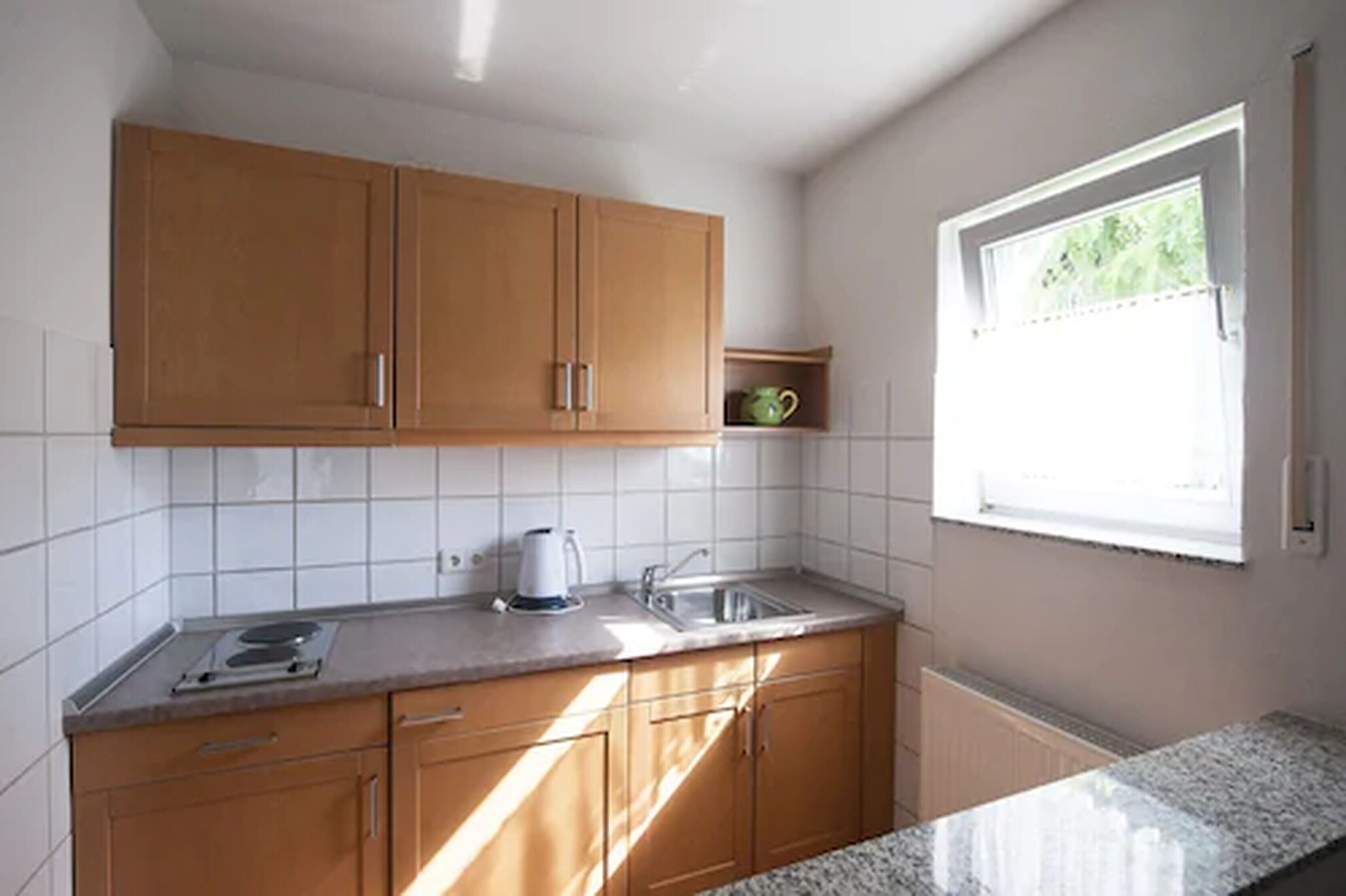 deluxe double room | private kitchen | fridge, stovetop, cleaning supplies