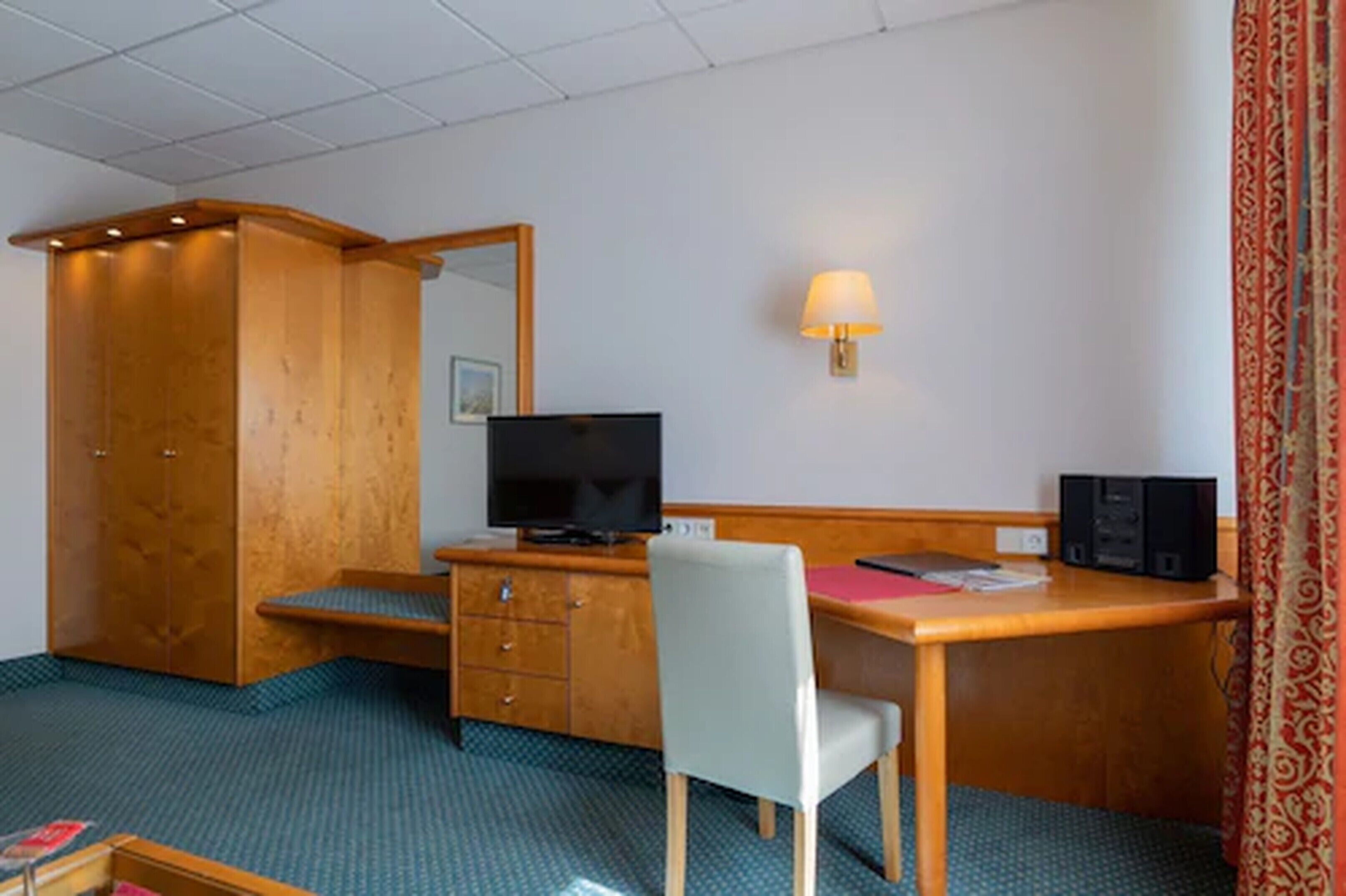 economy single room | living area | 50-inch flat-screen tv with digital channels