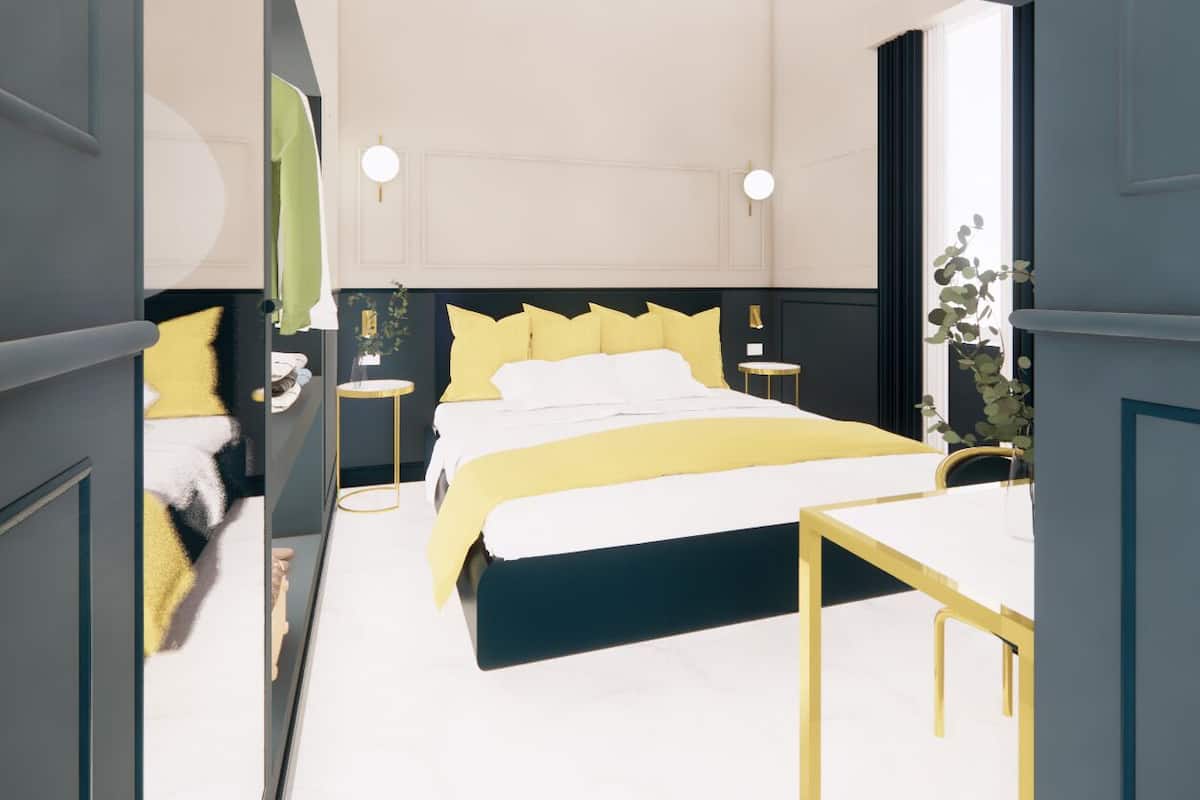 Un dormitorio moderno con cama, mesitas de noche y una ventana.