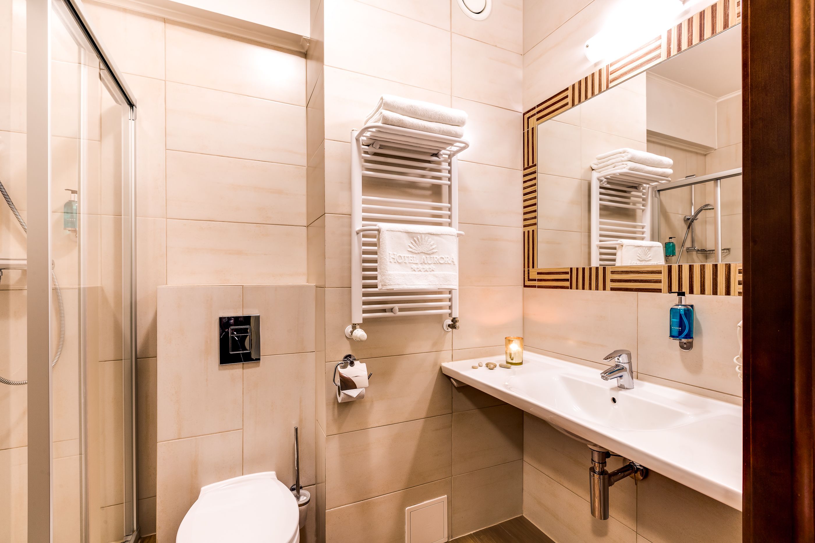 designer toiletries, hair dryer, bathrobes, towels