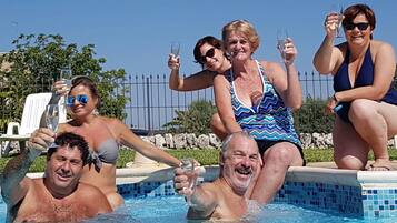 Outdoor pool, pool umbrellas, sun loungers