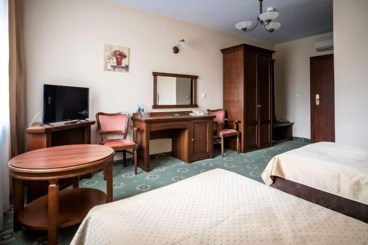 Hypo-allergenic bedding, desk, laptop workspace, blackout curtains