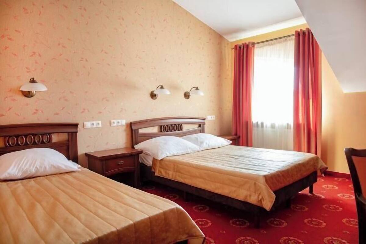 Hypo-allergenic bedding, desk, laptop workspace, blackout curtains