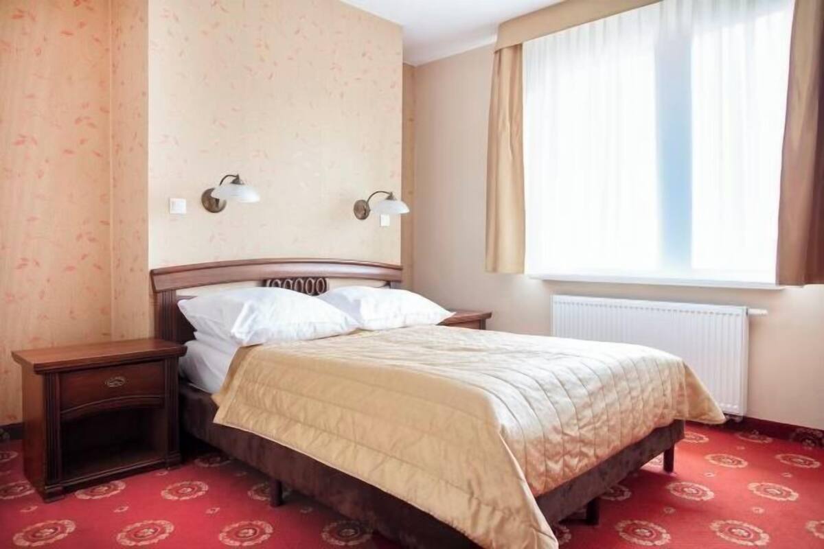 Hypo-allergenic bedding, desk, laptop workspace, blackout curtains