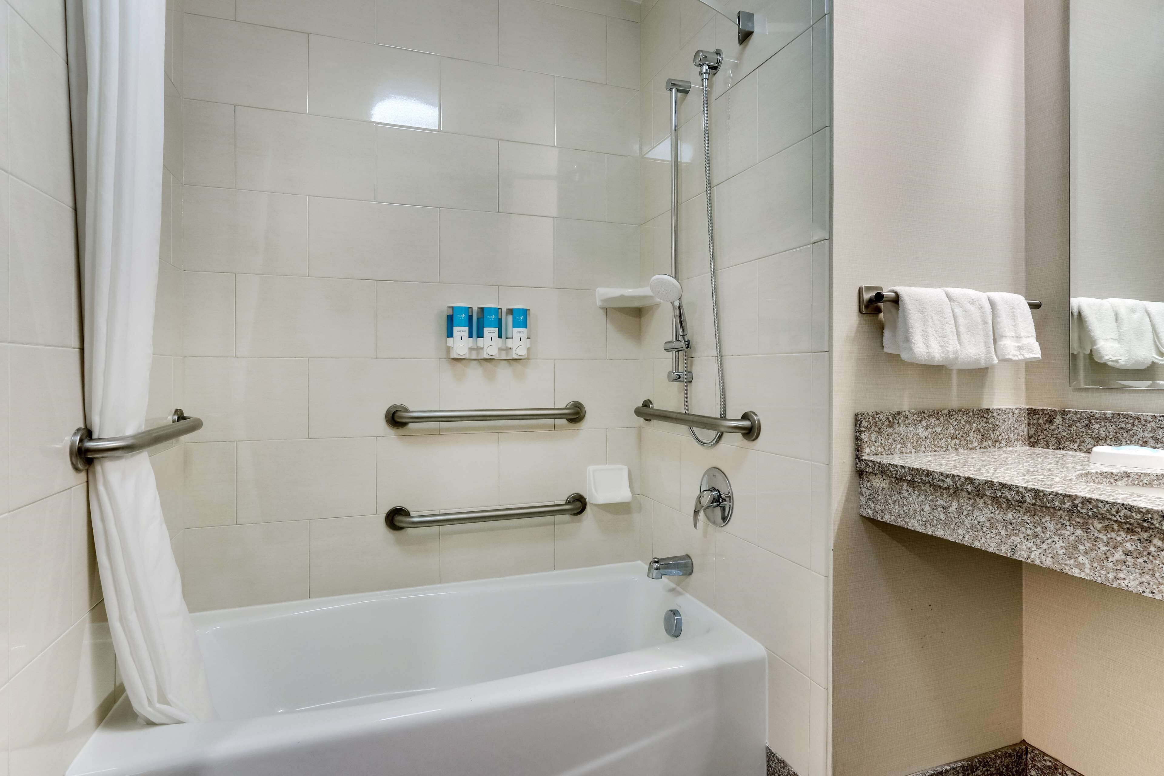 combined shower/bathtub, free toiletries, hair dryer, towels