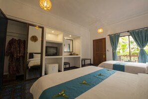 Deluxe Triple Room, Pool View | Minibar, in-room safe, individually decorated, individually furnished - La Niche d Angkor Boutique Hotel (Siem Reap)