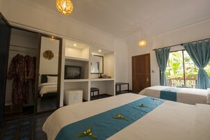 Deluxe Triple Room, Pool View | Minibar, in-room safe, individually decorated, individually furnished
