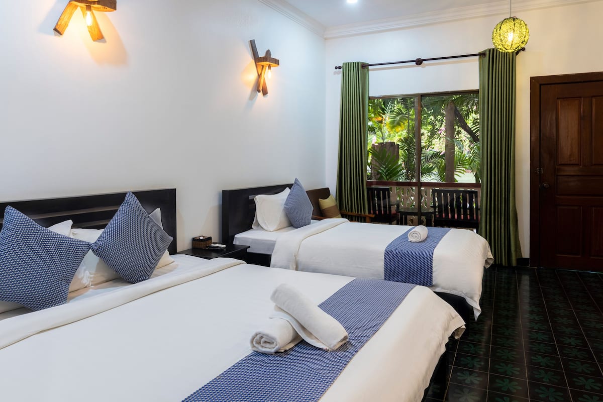 Deluxe Triple Room, Pool View | Terrace/patio