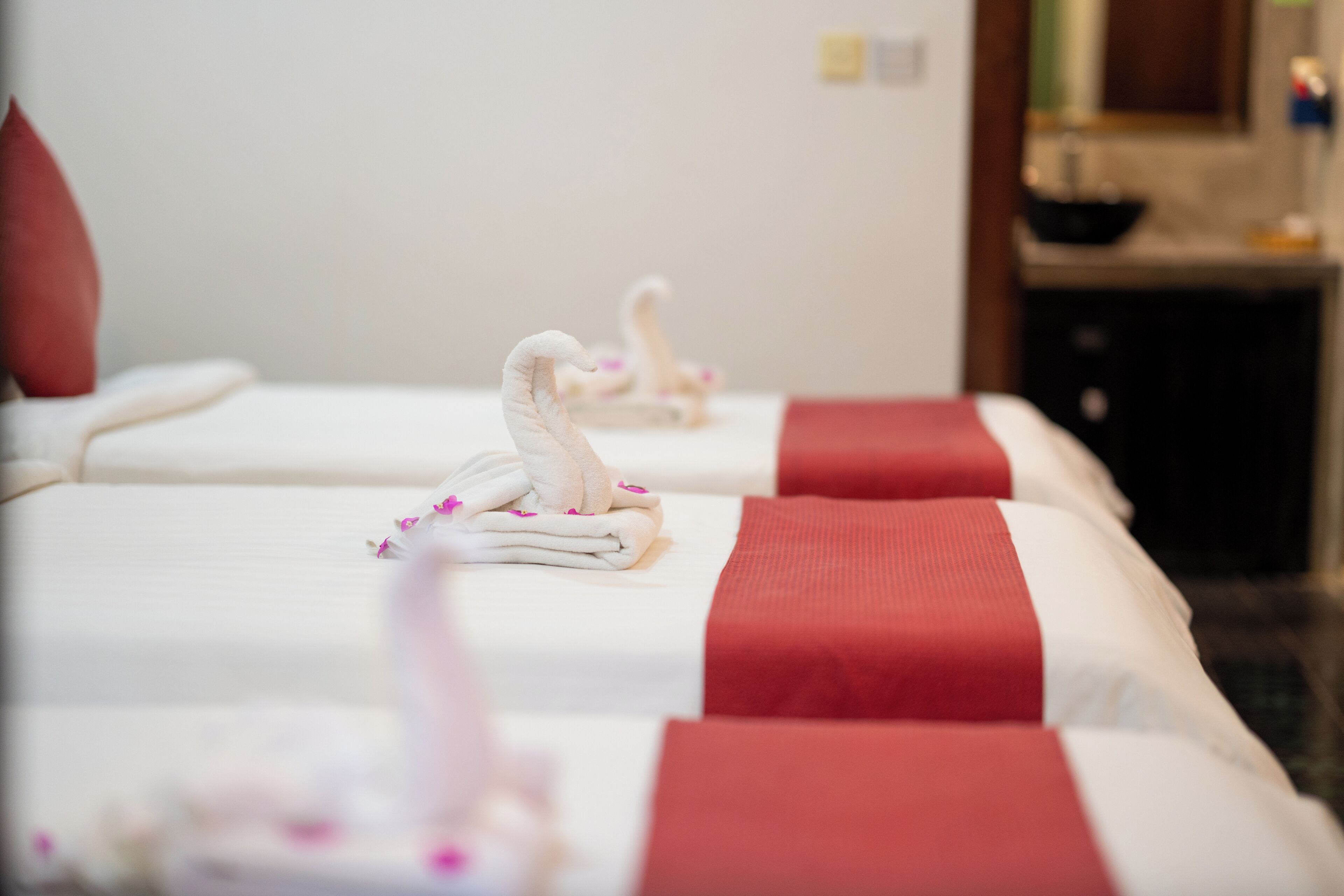 Deluxe Triple Room, Pool View | Minibar, in-room safe, individually decorated, individually furnished