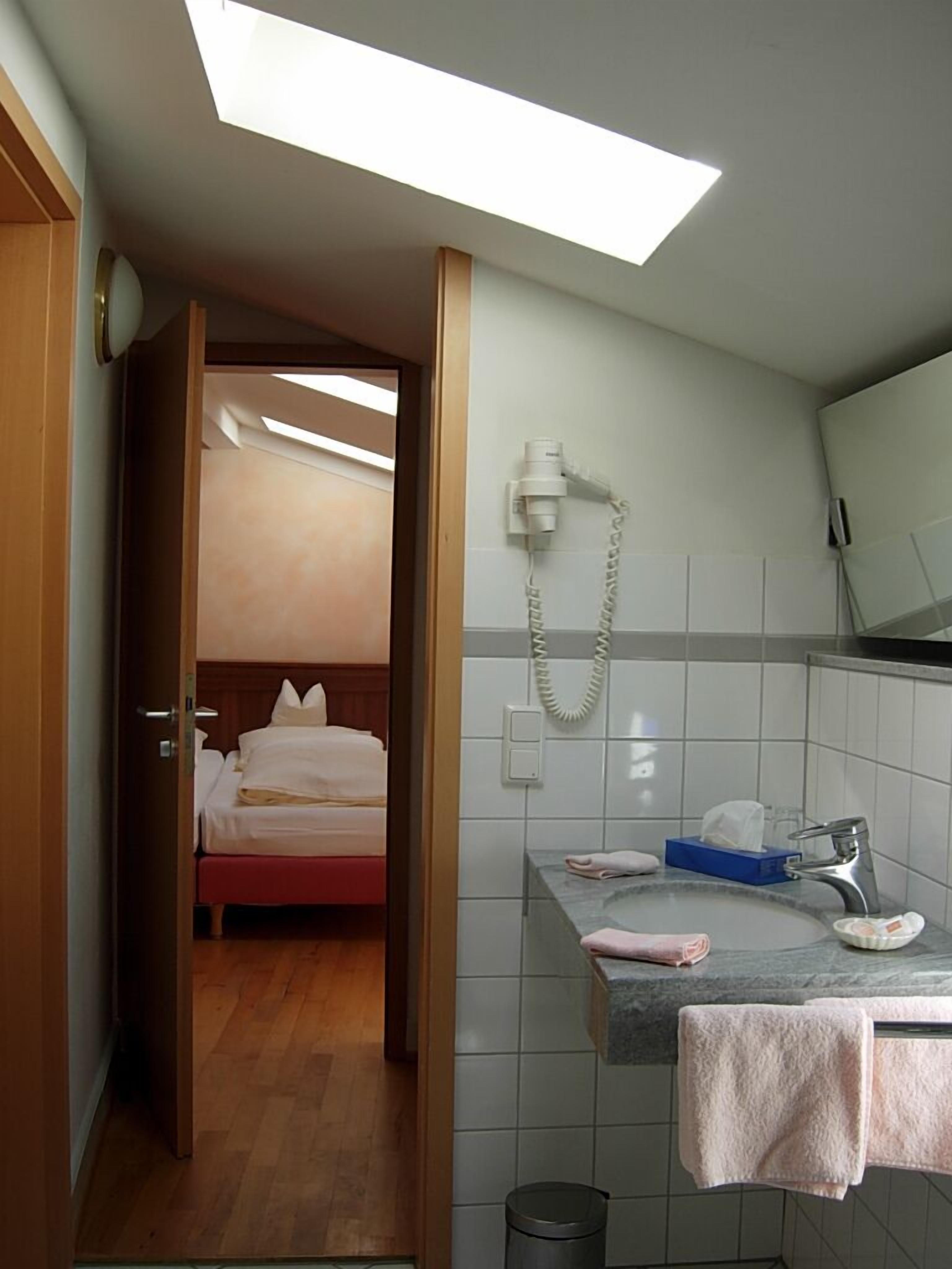 designer toiletries, hair dryer, towels