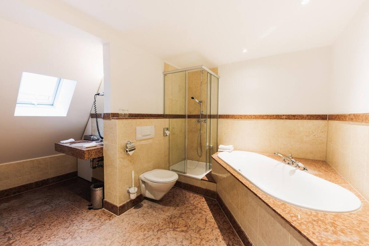 family suite, city view | bathroom | designer toiletries, hair dryer, towels