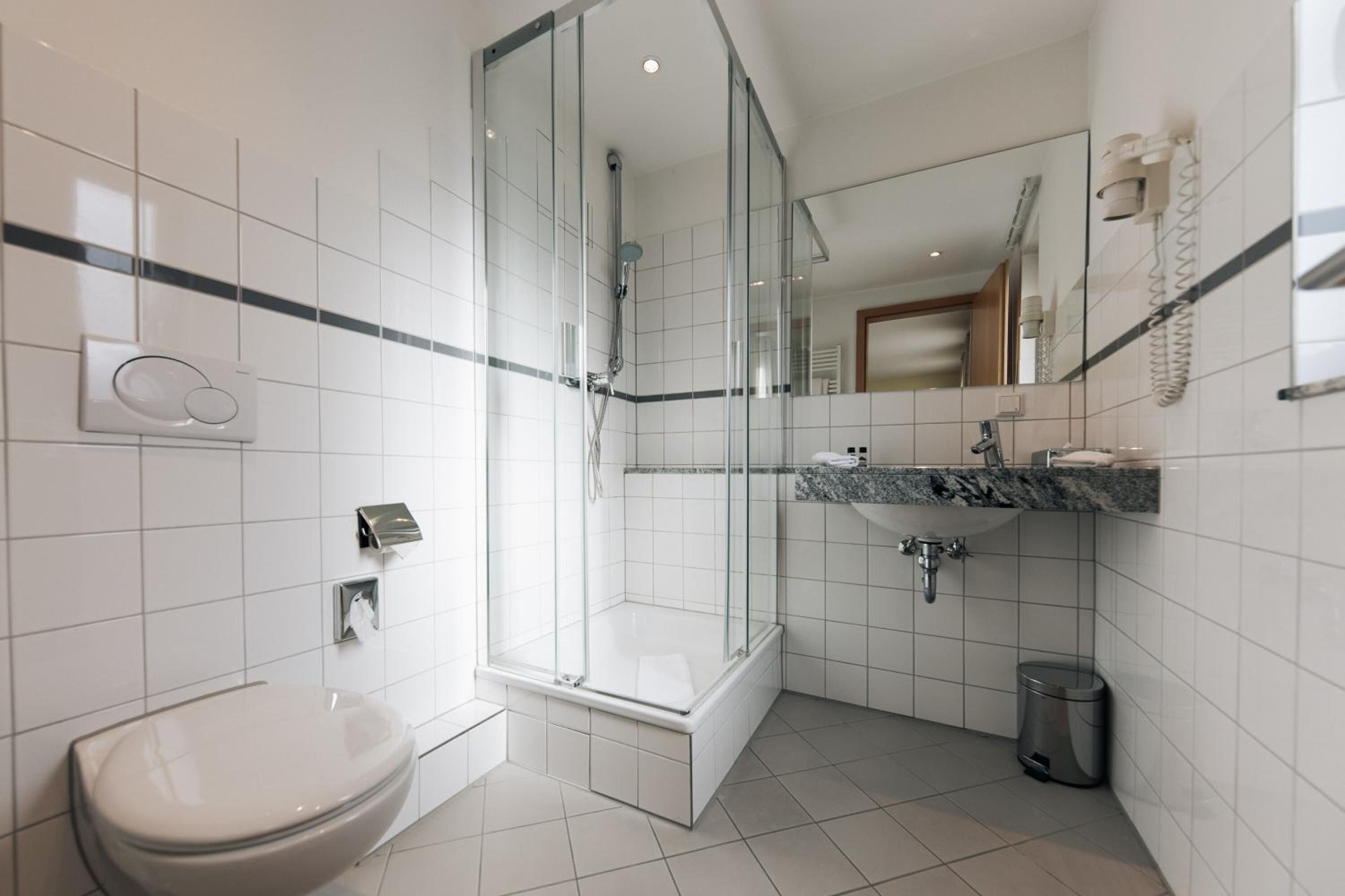 designer toiletries, hair dryer, towels