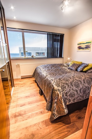 Apartment, 1 Bedroom | Down comforters, pillowtop beds, individually decorated - Draumholl Apartments (Reykjavik)