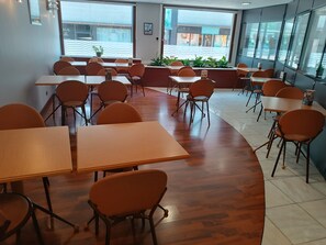 Enjoy casual dining in this stylish indoor space with large windows offering a view of the street.