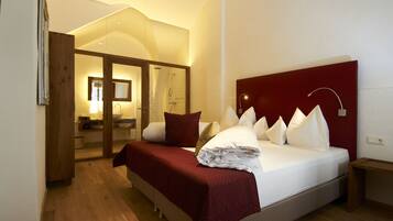 Premium bedding, pillow-top beds, free minibar, in-room safe