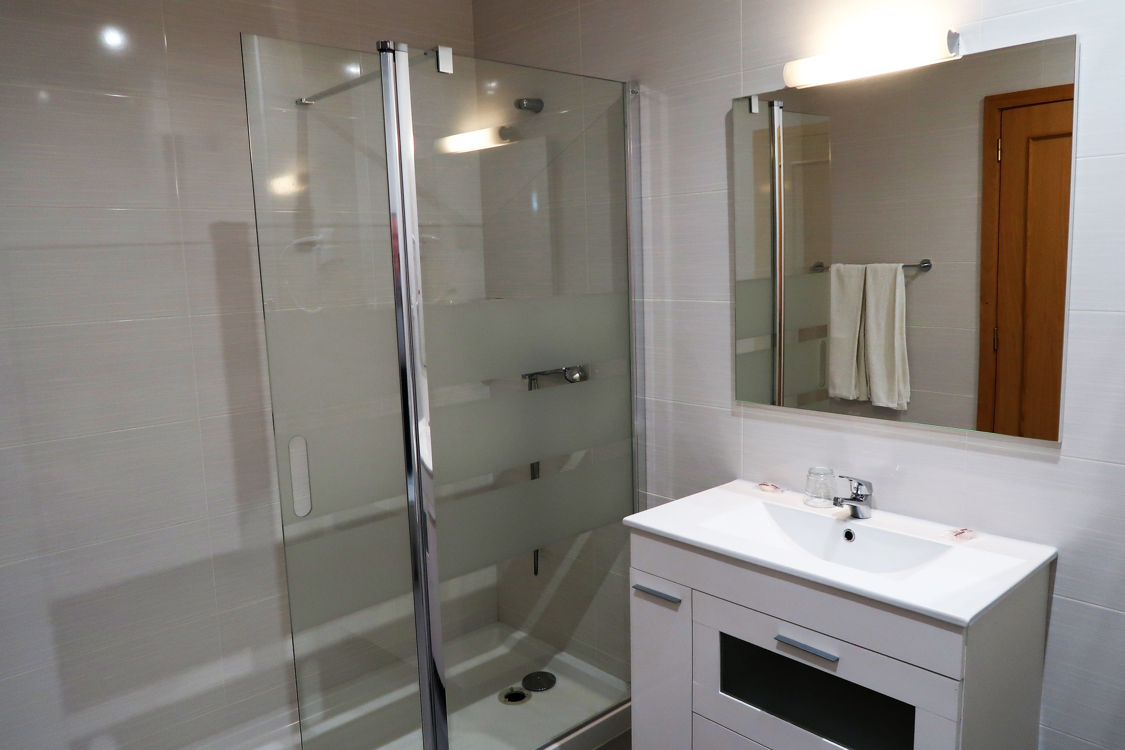 hair dryer, bathrobes, bidet, towels