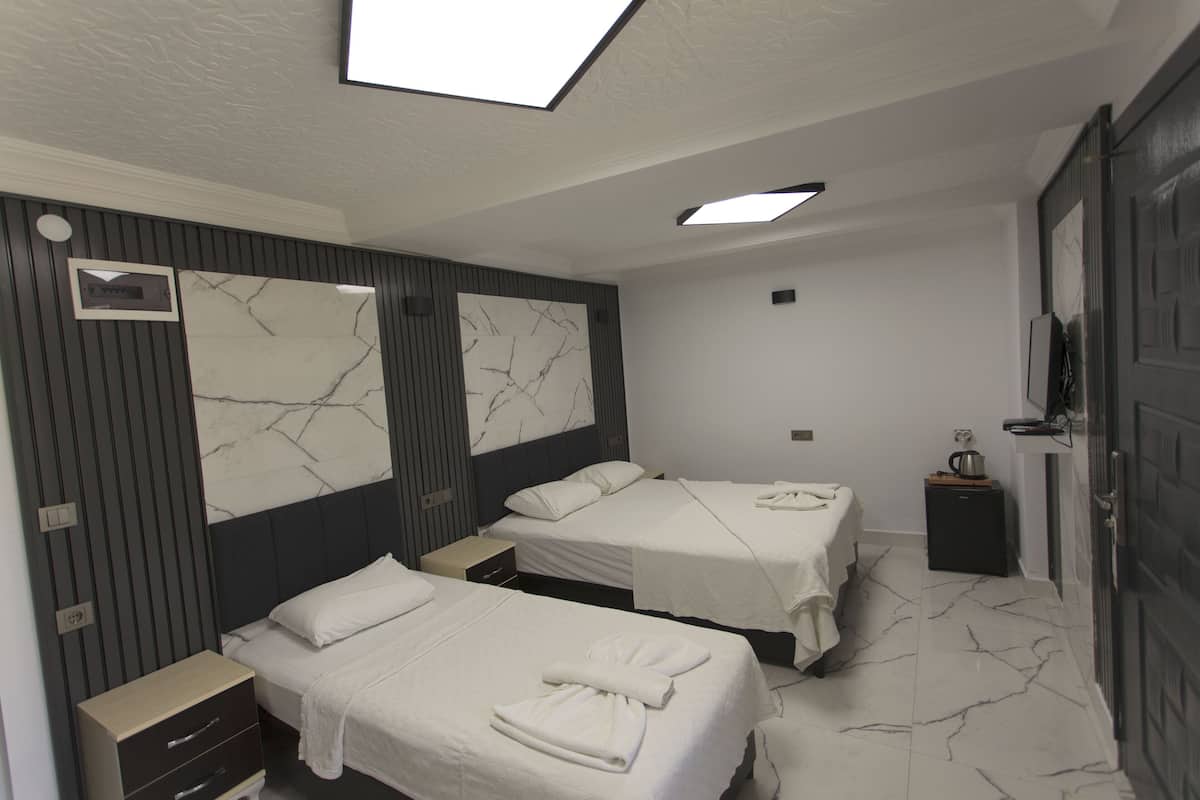 Familie driepersoonskamer | Een minibar, gratis wifi, beddengoed