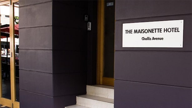 The exterior of The Maisonette Hotel with a sign indicating its name and address on Challis Avenue. - The Maisonette (Potts Point)