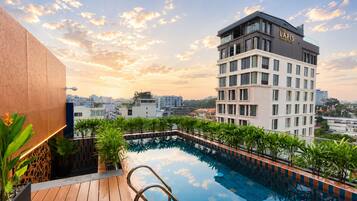 Outdoor pool, open 7:00 AM to 7:00 PM, pool umbrellas, pool loungers