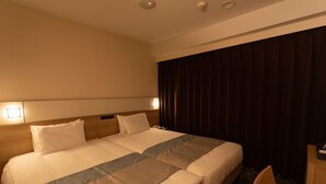 A hotel room with two beds, a desk, and a chair. - Almont Hotel Naha Omoromachi (Naha)