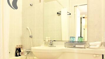 Combined shower/tub, free toiletries, hair dryer, slippers