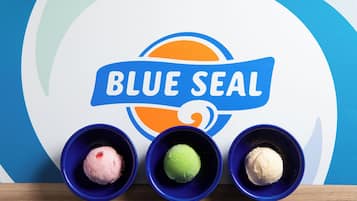 Three bowls of ice cream with a 'BLUE SEAL' logo on a placemat.