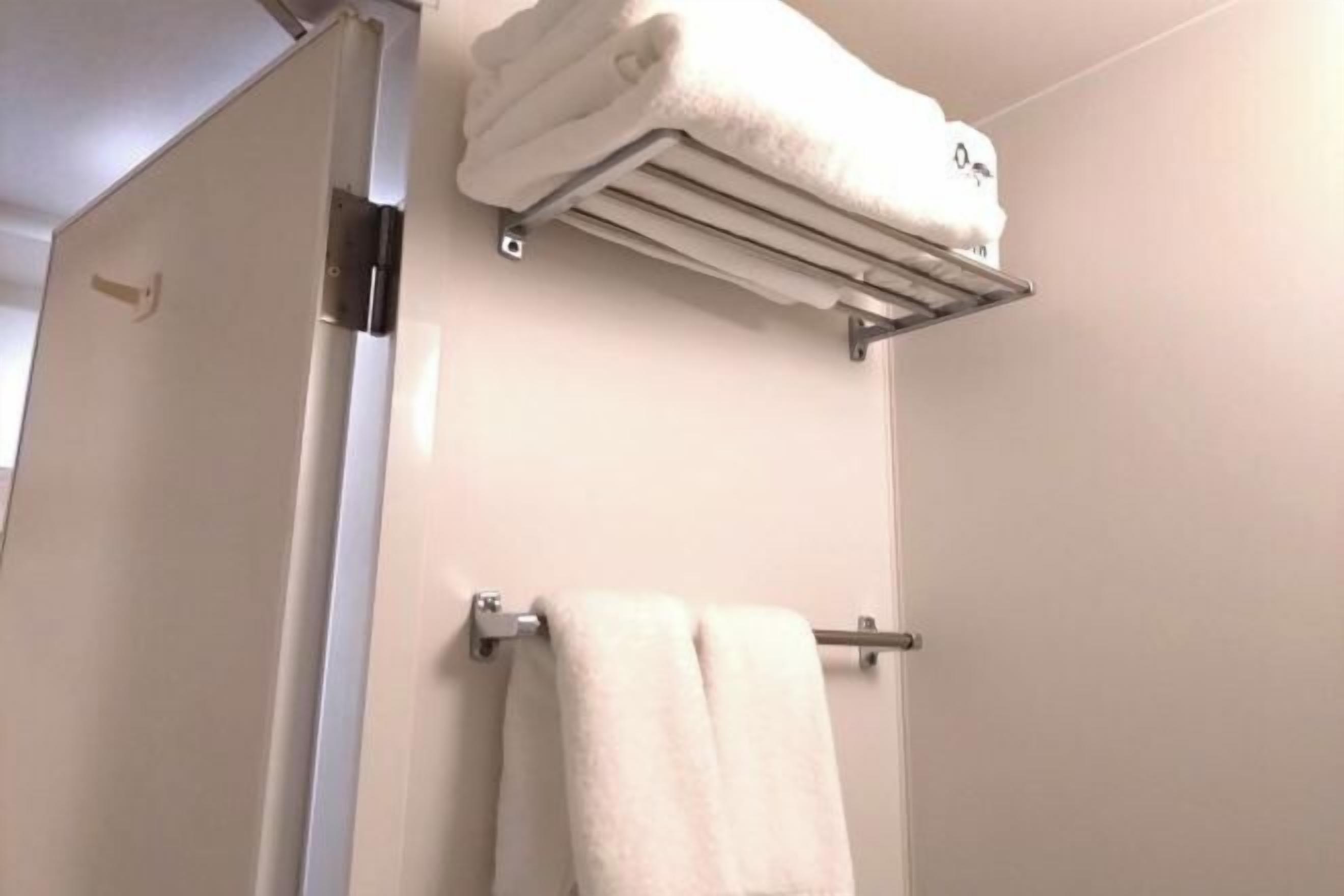 Combined shower/tub, free toiletries, hair dryer, slippers