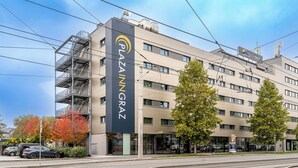 A multi-story building with a prominent sign reading "PLAZA IN GRAZ". - PLAZA INN Graz Messe (Graz)