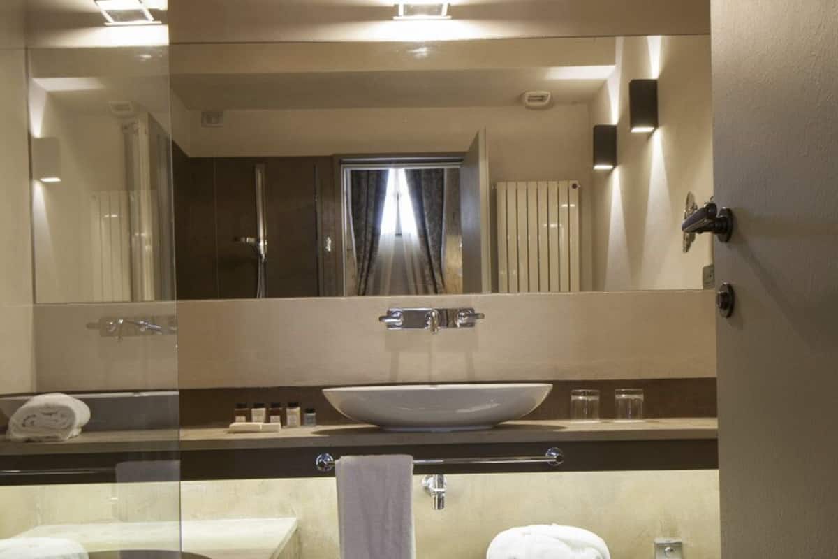 designer toiletries, hair dryer, bathrobes, slippers