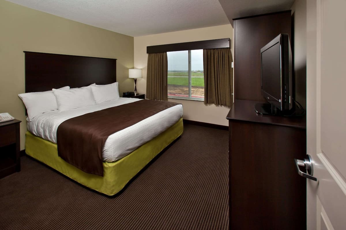 Premium bedding, desk, laptop workspace, blackout curtains