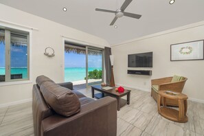 Villa, Beachfront | Living area | 40-inch plasma TV with satellite channels, TV, DVD player - Sea Change Villas (Rarotonga)