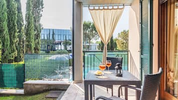 Apartment, 1 Bedroom, Balcony | 1 bedroom, in-room safe, desk, iron/ironing board