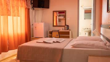 Standard Double Room | Minibar, in-room safe, desk, blackout drapes