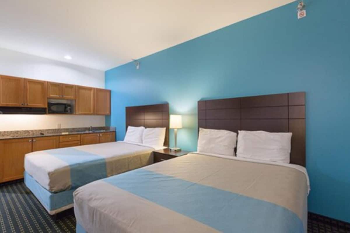 standard room, 2 queen beds, kitchenette | iron/ironing board, free wifi, bed sheets