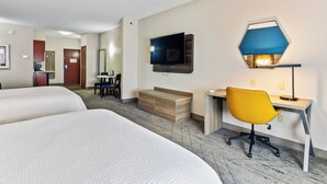 A hotel room with two beds, a desk with a chair, a TV mounted on the wall, and a small seating area with a table and chairs. - Holiday Inn Express and Suites Wytheville by IHG (Wytheville)
