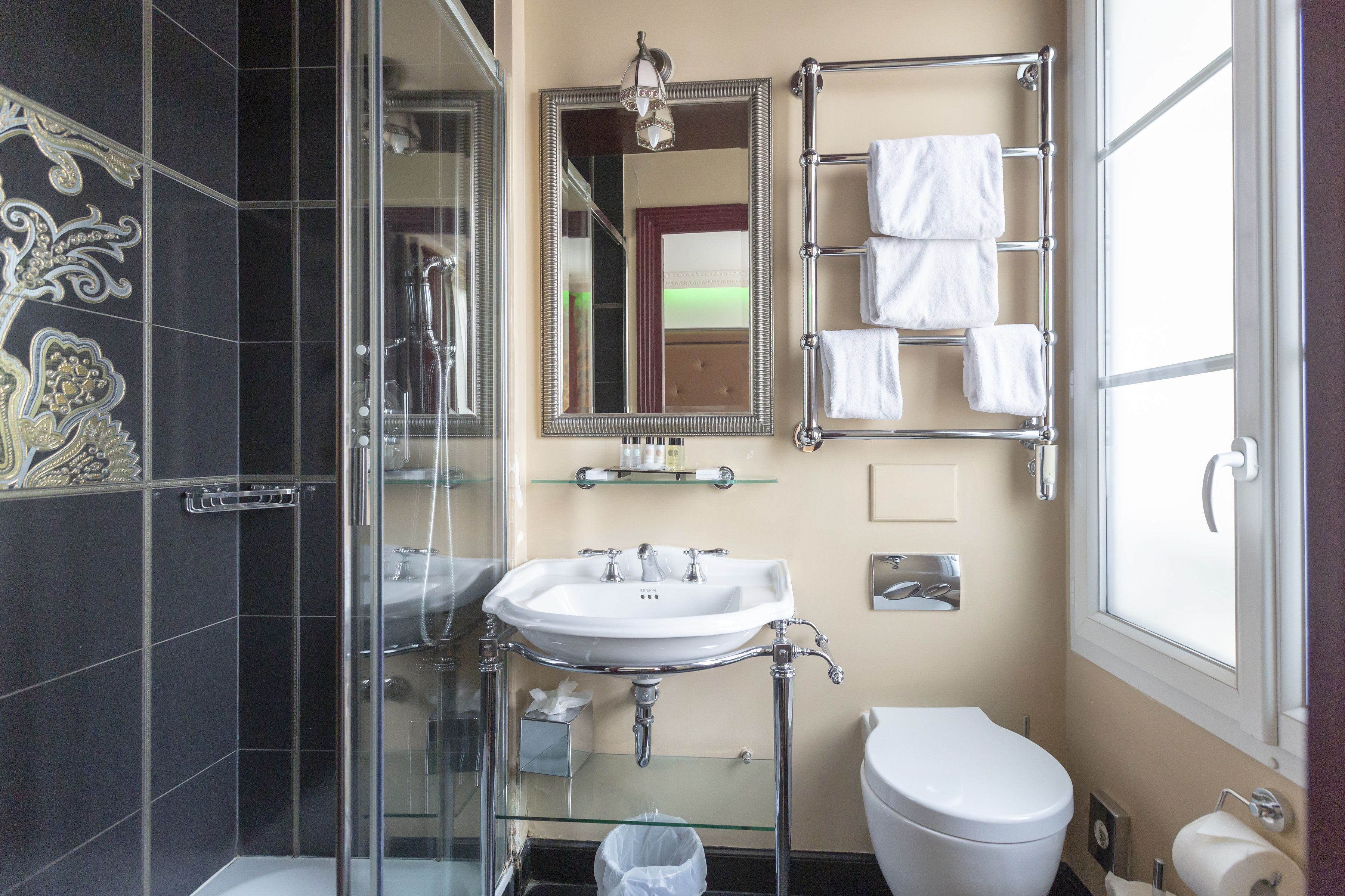 standard room | bathroom | rainfall showerhead, designer toiletries, hair dryer, slippers