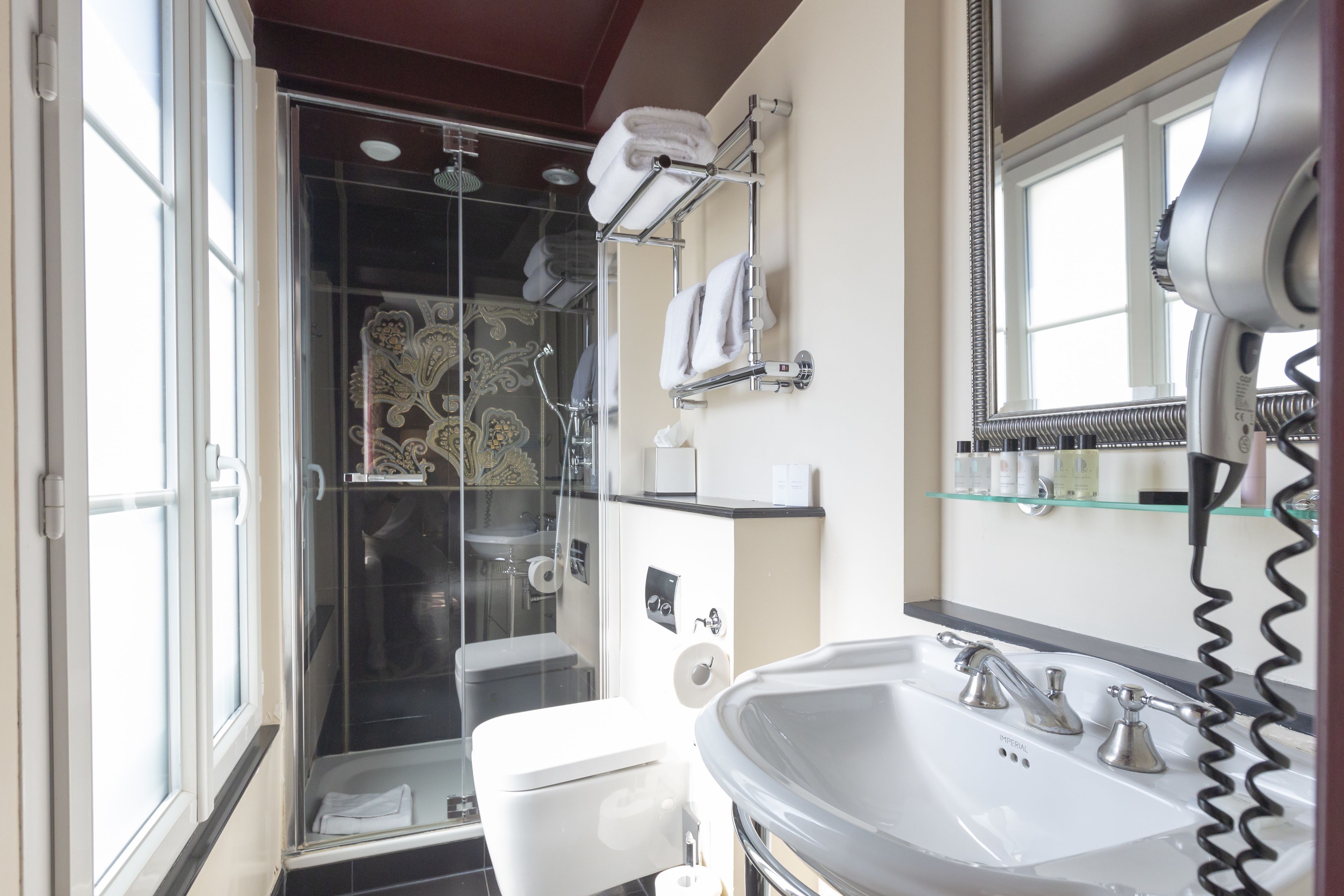 superior room | bathroom | rainfall showerhead, designer toiletries, hair dryer, slippers