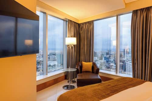 Suite Deluxe, 1 chambre | Aire de séjour | Téléviseur, lecteur de DVD