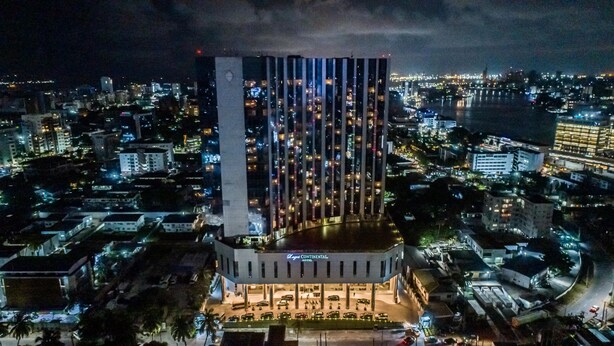 A high-rise hotel with a modern design, featuring a prominent vertical facade and a well-lit entrance area. - Lagos Continental Hotel (Lagos)